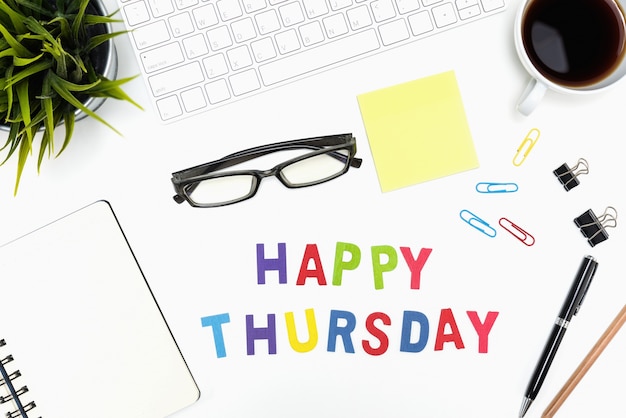 Free photo office desk table with happy thursday word