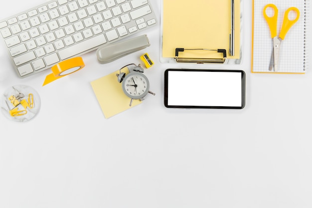 Office desk with keyboard and mobile phone