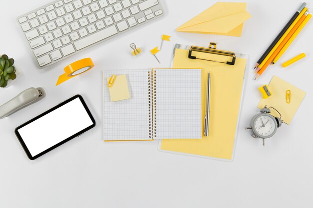 Office desk with keyboard and mobile phone