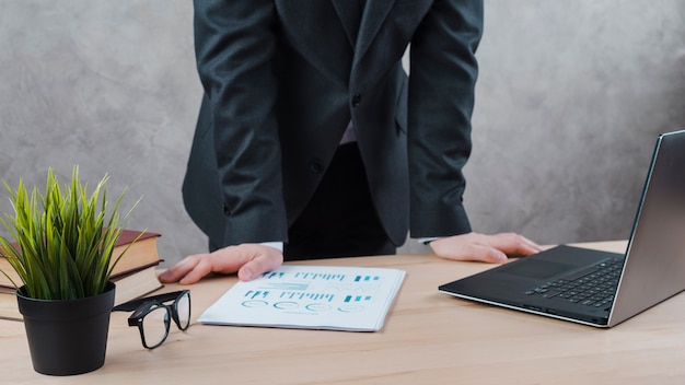 Free photo office desktop with laptop and a glasses