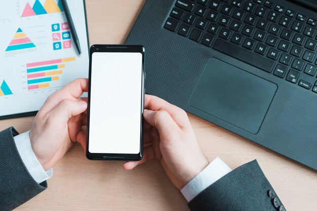 Office desktop with laptop and mobile phone