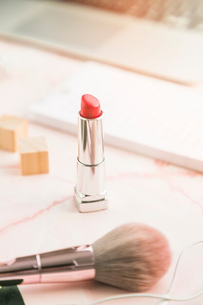 Office desktop with a lipstick