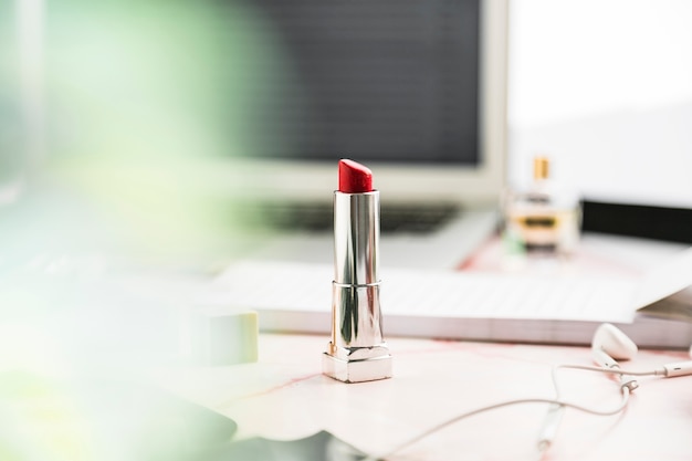 Office desktop with a lipstick