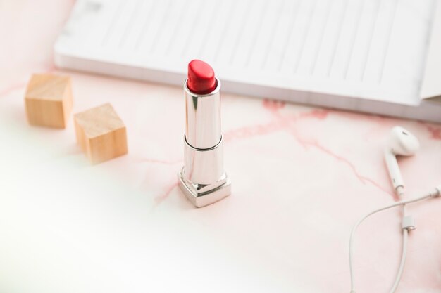 Office desktop with a lipstick
