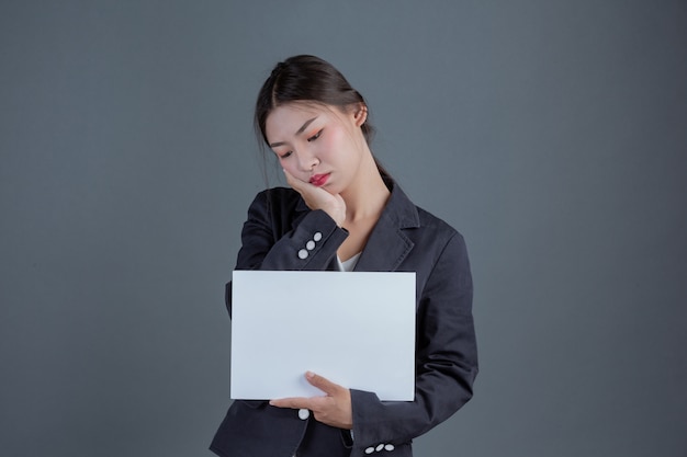 Office girl holding a white blank board