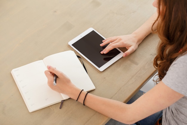 Office, home. woman by the table