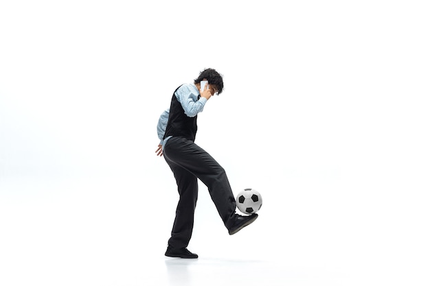 Office man playing football on white