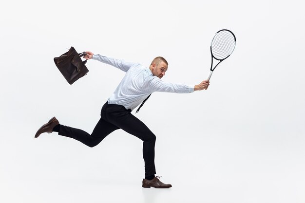 Office man plays tennis on white