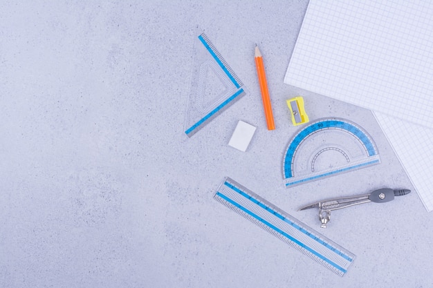 Office or school tools with paper and pencils