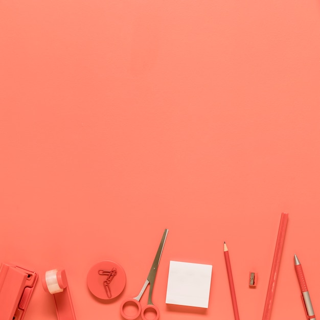 Office stationery on red background