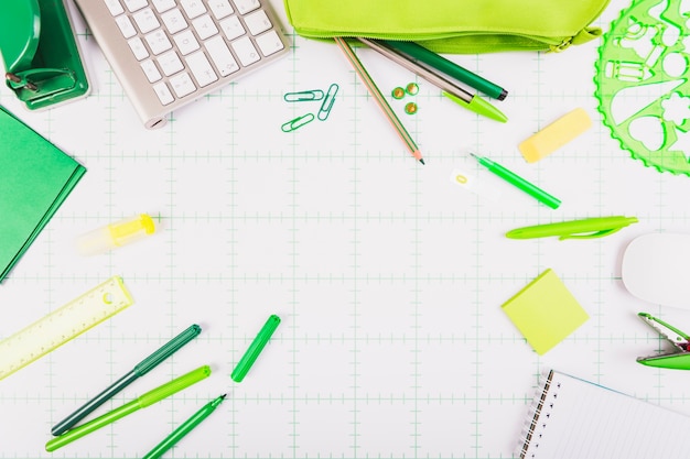 Office stationery scattered on table