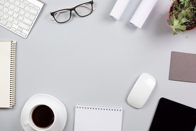 Office supplies on gray desk with space for writing the text