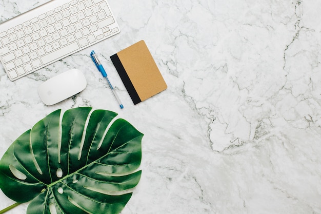 Free photo office supplies on a marble table.