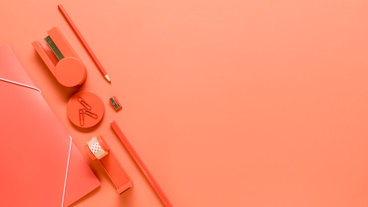 Free Photo office supplies on orange background