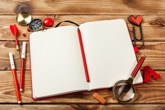 Office supplies on wooden background