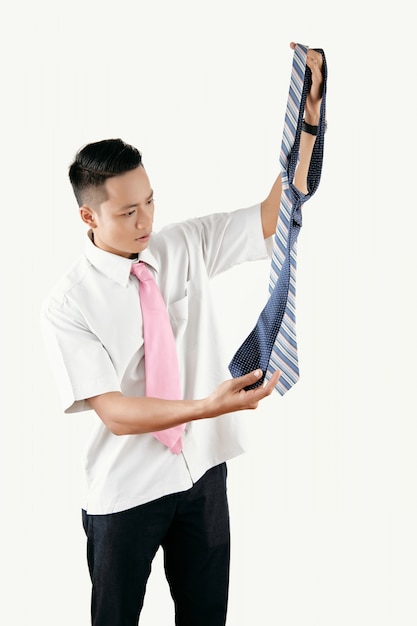 Free photo office worker choosing tie