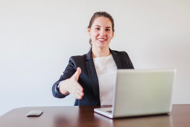 Office worker giving hand for shake