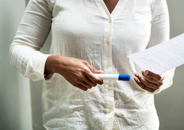 Free photo office worker holding a marker