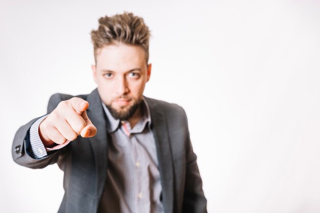 Office worker pointing at camera