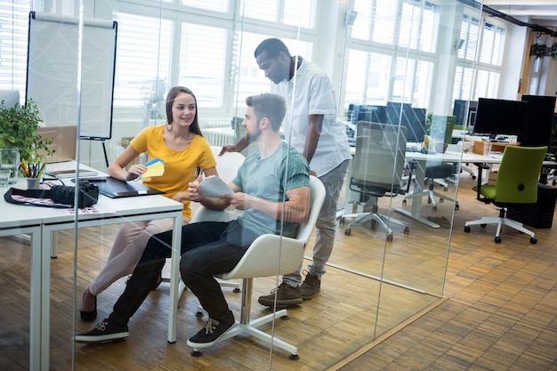 Free photo office workers in a glass