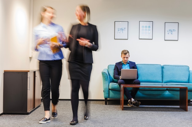 Office workers spending time in room