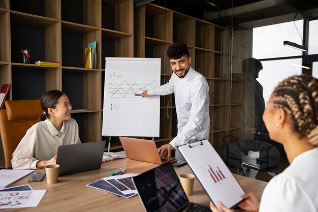 Office workers using finance graphs