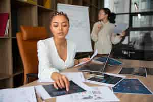 Free photo office workers using finance graphs