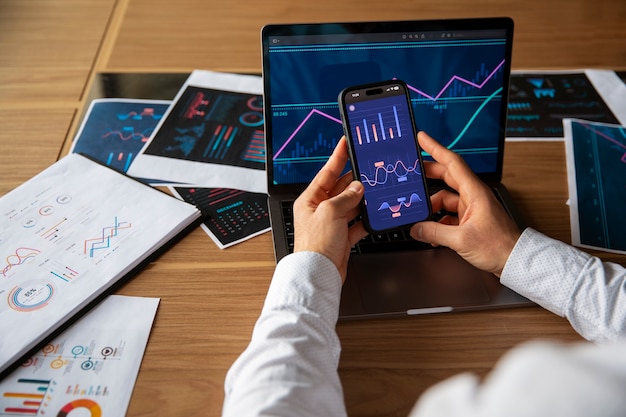 Office workers using finance graphs