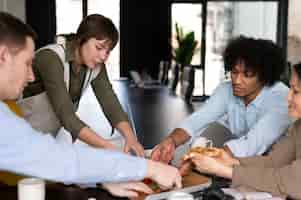 Free photo office workers working together as a team