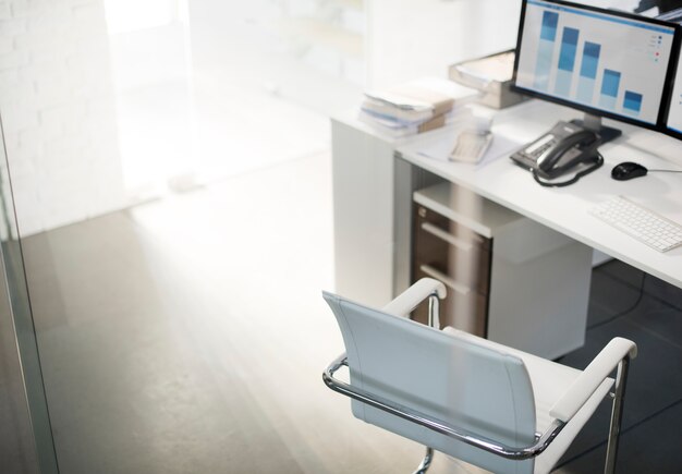 Office workspace with computer desktop showing analysis graph