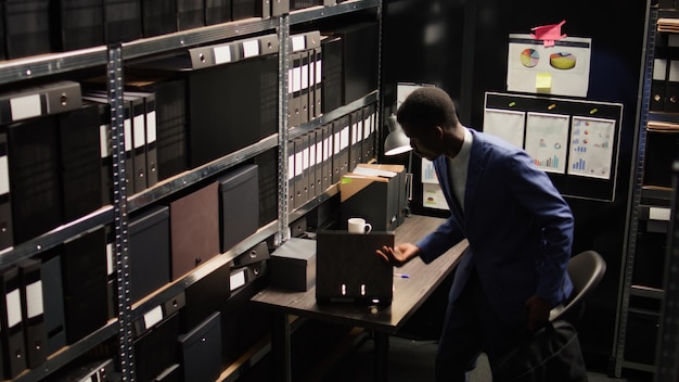 Free photo officer walks out of office with laptop