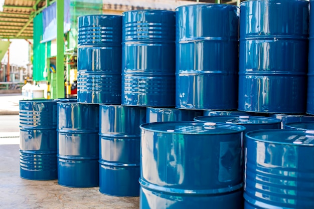 Oil barrels blue or chemical drums vertical stacked up Premium Photo