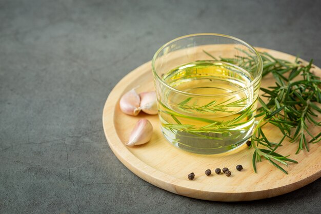 Oil with rosemary on table