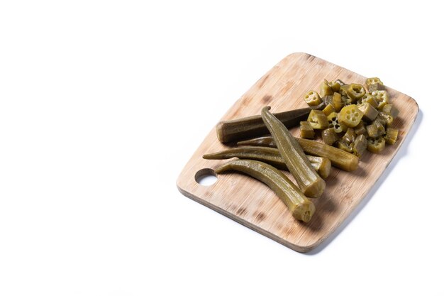 Okra slices on wooden table