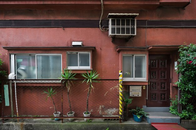 Old abandoned house with potted plants