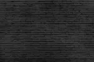 Free photo old black brick wall background