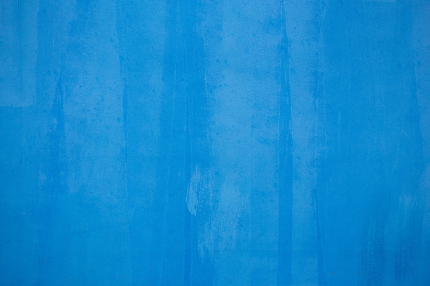 Старая голубая предпосылка текстуры стены.
