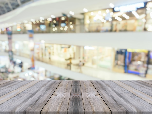 Old boards with blurred shopping mall