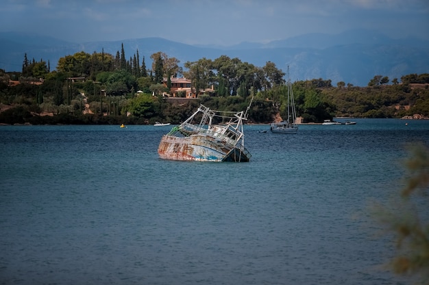 Old boat looks from under the water