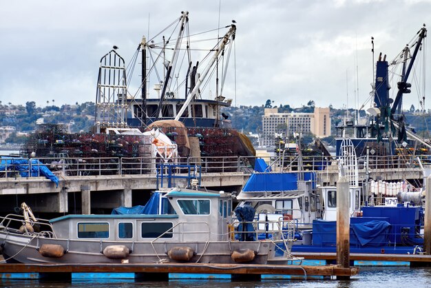 Old Boats in a port and a pier in the evening