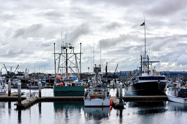 Old Boats in a port and a pier in the evening