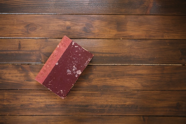 Old book on wooden background