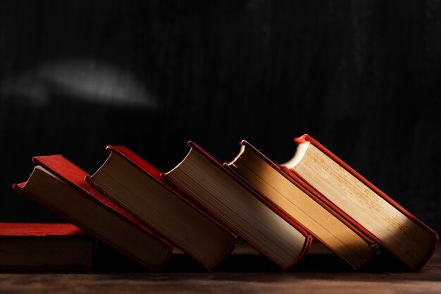 Old books arrangement with light