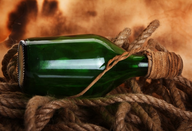 Old bottle and rope