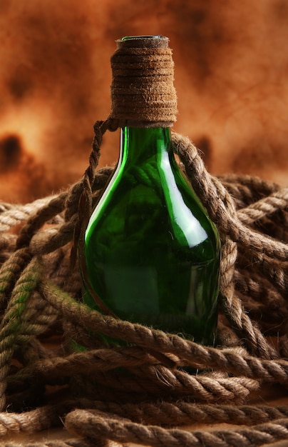 Free photo old bottle and rope