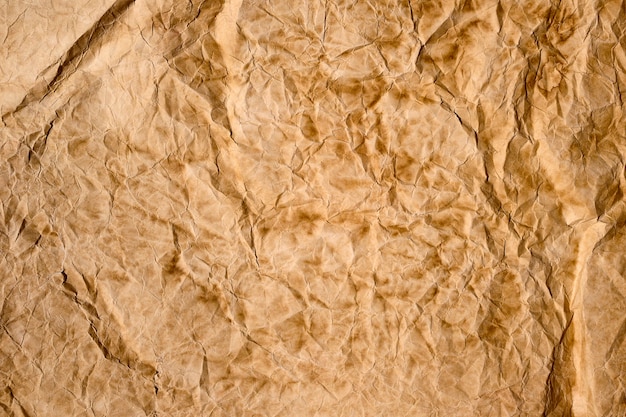 Old brown crumpled paper texture background sheet of paper backdrop