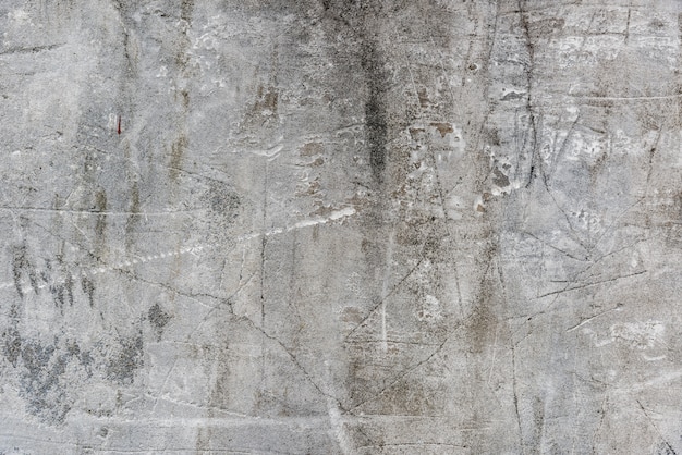 Free photo old cement wall with scratches