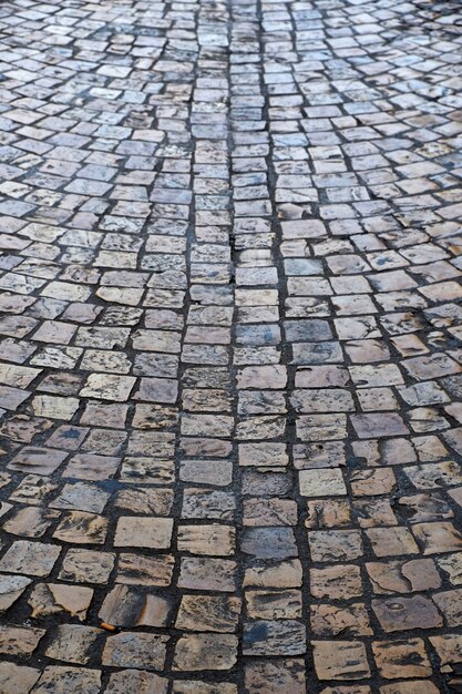 Old cobblestone street background texture vertical