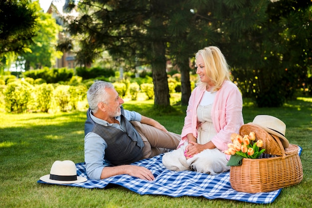 Old couple having a good time at nature