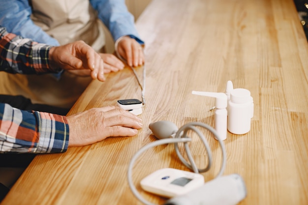 Old couple in a kitchen.